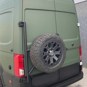 Dutchvanparts tire carrier for Volkwagen Crafter (2019+) on an army green wrapped Crafter van.